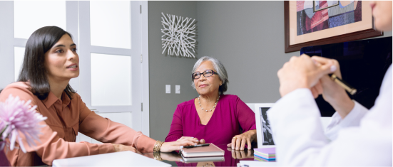 A caregiver advocate speaking on behalf of a patient to their doctor